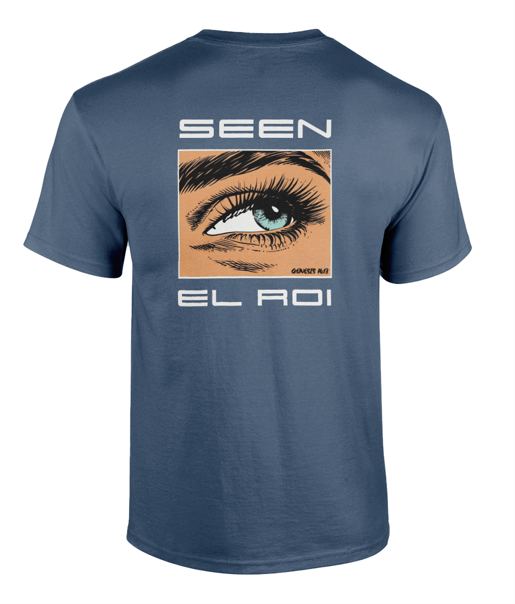 Black Christian graphic t-shirt featuring a detailed illustrated blue eye with the words "SEEN" and "EL ROI," referencing Genesis 16:13 and the biblical name for God meaning "The God Who Sees Me." Modern faith-based streetwear design displayed on black, blue, and olive green shirts.